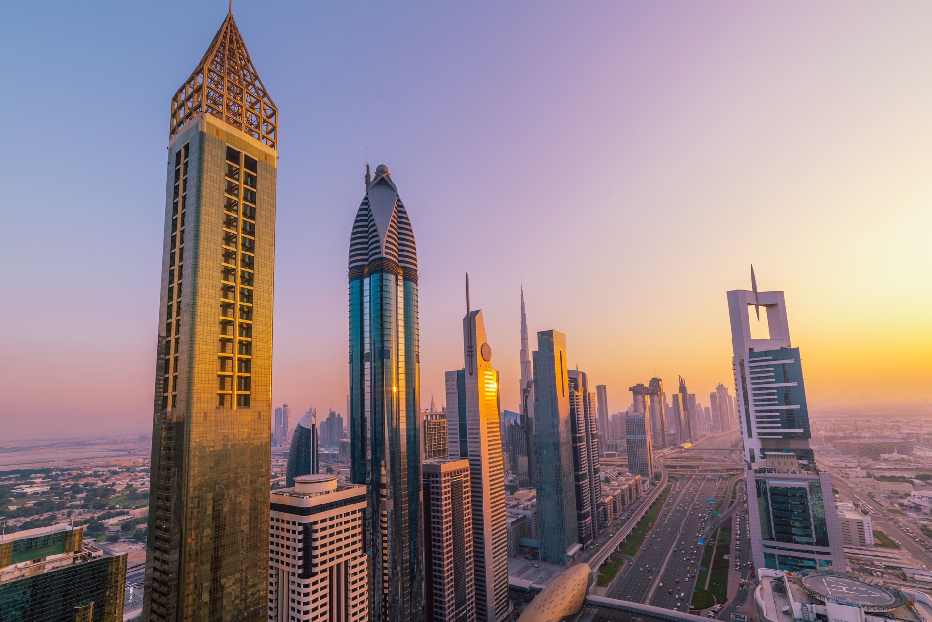 Golden Sunset Illuminating Dubai Skyline with Iconic Skyscrapers